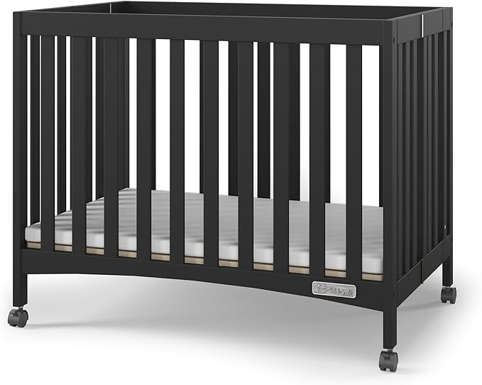 Child Craft London Mini Compact Folding Portable Crib with 2” Crib Mattress and 2 Easy Roll Locking Wheels, Durable Pine Wood Construction (Ebony Black)-CubbioJoy