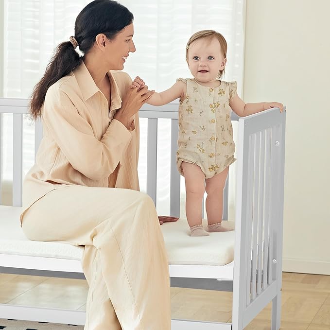 EvoNest Baby Crib, 11 in 1 Convertible Mini Crib with Wheels, 100% New Zealand Wood Growing Bed, 4 Adjustable Mattress Height,White-CubbioJoy