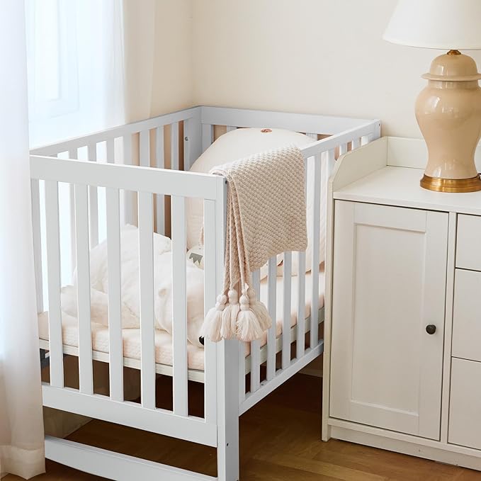 EvoNest Baby Crib, 11 in 1 Convertible Mini Crib with Wheels, 100% New Zealand Wood Growing Bed, 4 Adjustable Mattress Height,White-CubbioJoy