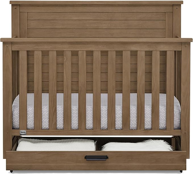 Delta Children Simmons Kids Caden 6-in-1 Convertible Crib with Trundle Drawer, Greenguard Gold Certified, Aged Oak-CubbioJoy